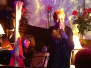 Carol Robbins Performing with standing Carmen Lundy on stage.