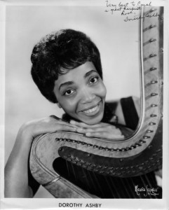 Dorothy Ashby signed photo posing with her beloved harp.