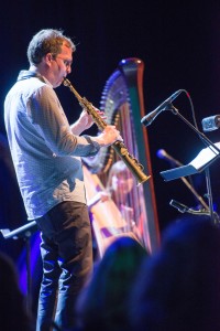 Photo of Geof Bradfield and Carol Robbins performing on stage at Lyon & Healy's 150th Birthday Celebration at Park West in Chicago. Photo © Copyright 2014 Lyon & Healy Harps, Inc., Chicago.