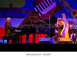 Carol Robbins with harp in concert with Billy Childs, piano, and Becca Stevens, singing.